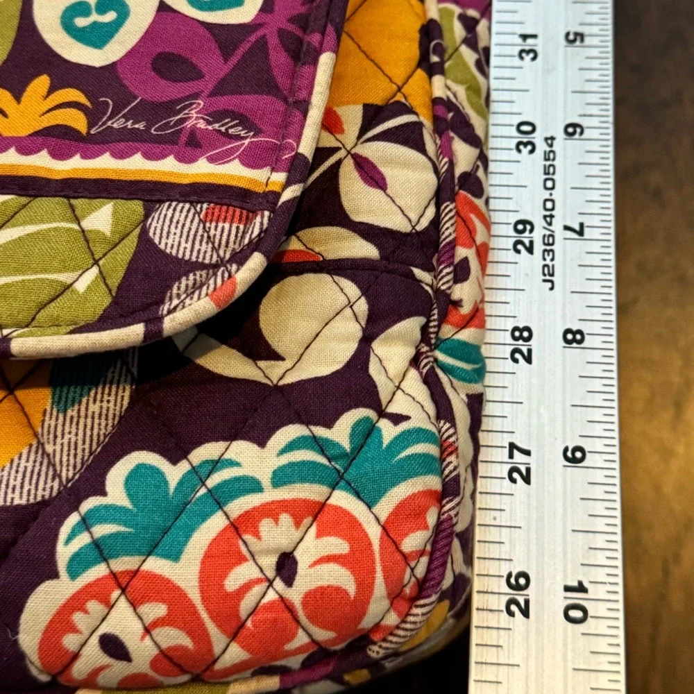 Vera Bradley Retired Messenger/Computer Bag in the Plum Crazy pattern.